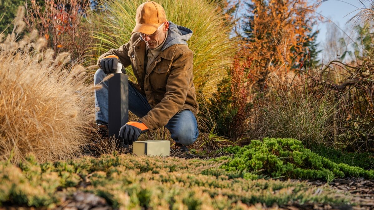 Man Practicing Winter Lawn Care On Wichita Lawn